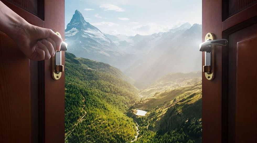 Door opening to beautiful mountain view.
