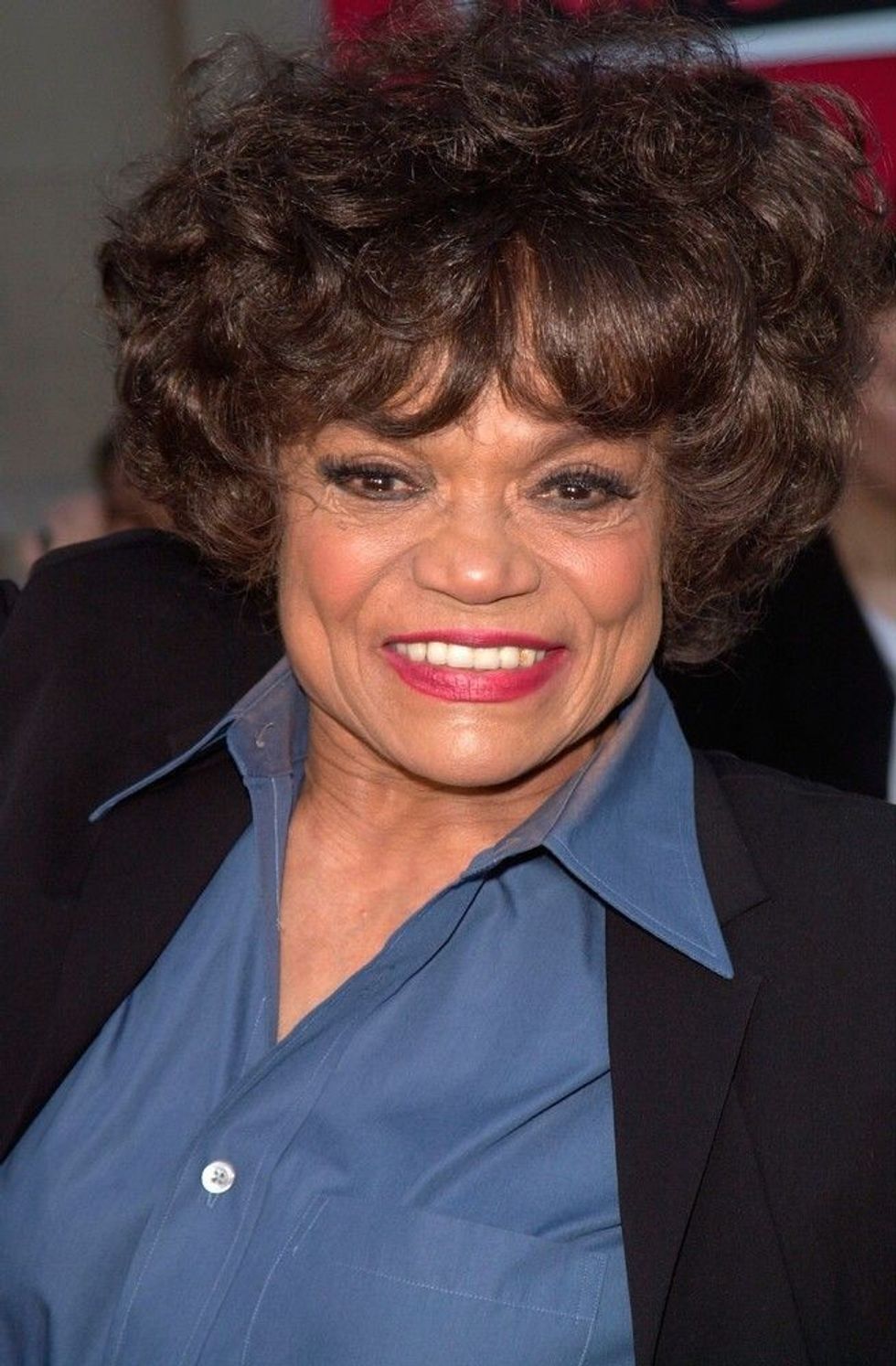Eartha Kitt wearing blue shirt black suit