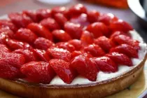 Eat a pie served with cream and fresh strawberries on National Strawberry Cream Pie Day.