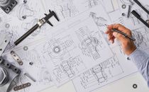 Engineer technician designing drawings