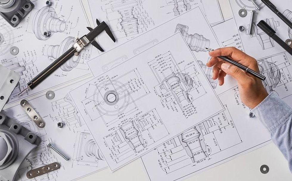 Engineer technician designing drawings