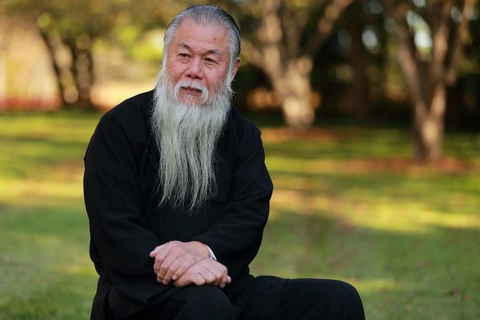 Environmental portrait of a senior man with long beard