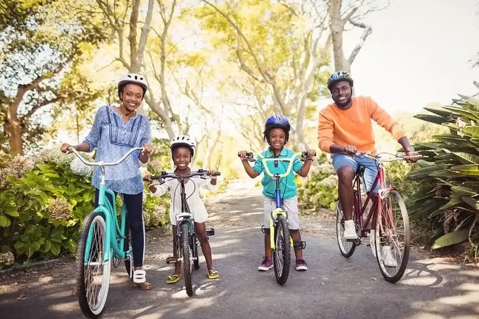 Family cycling through countryside