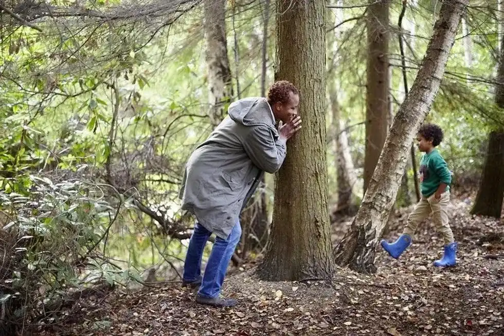 Family playing in woods