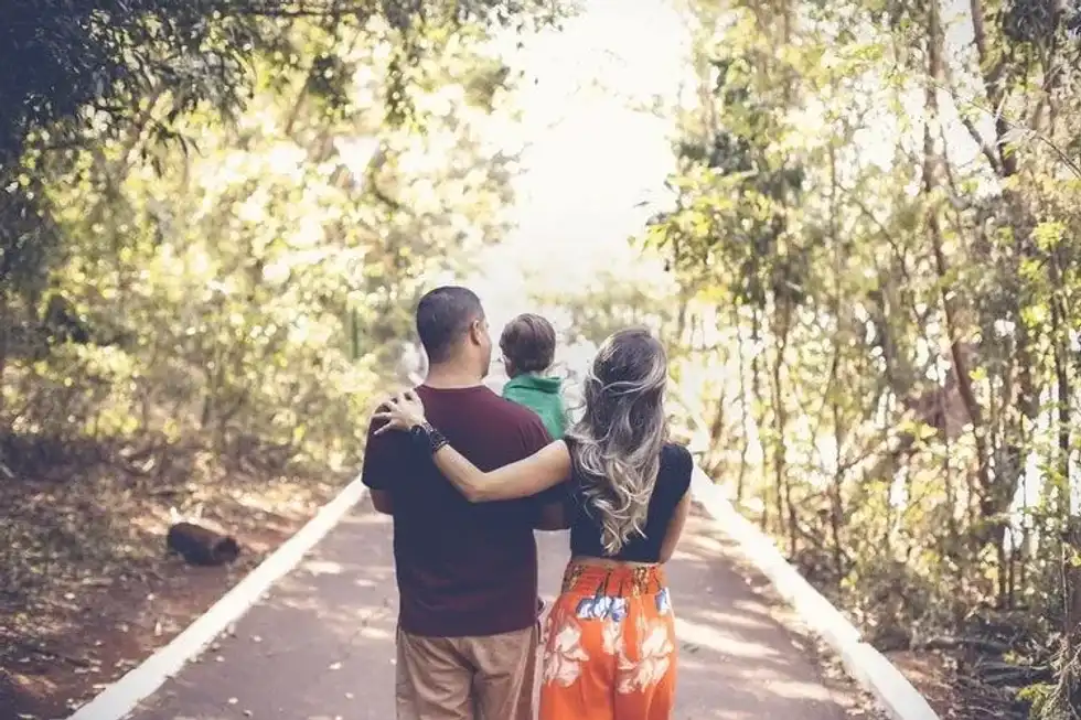 Family walking on a road 