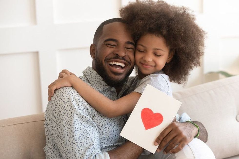 Father and daughter hugging together