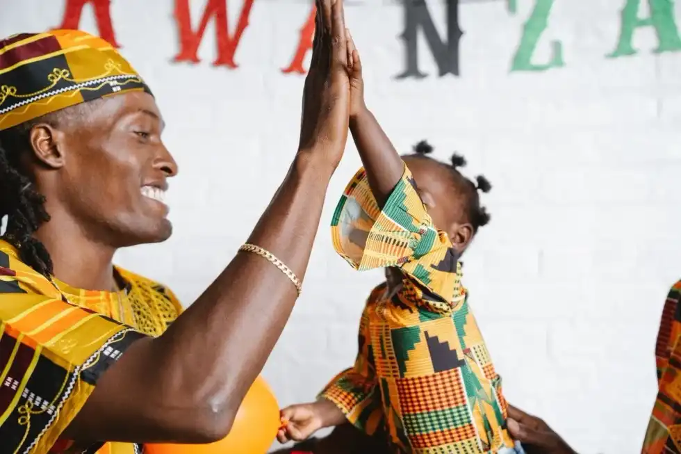 Father giving his daughter high five