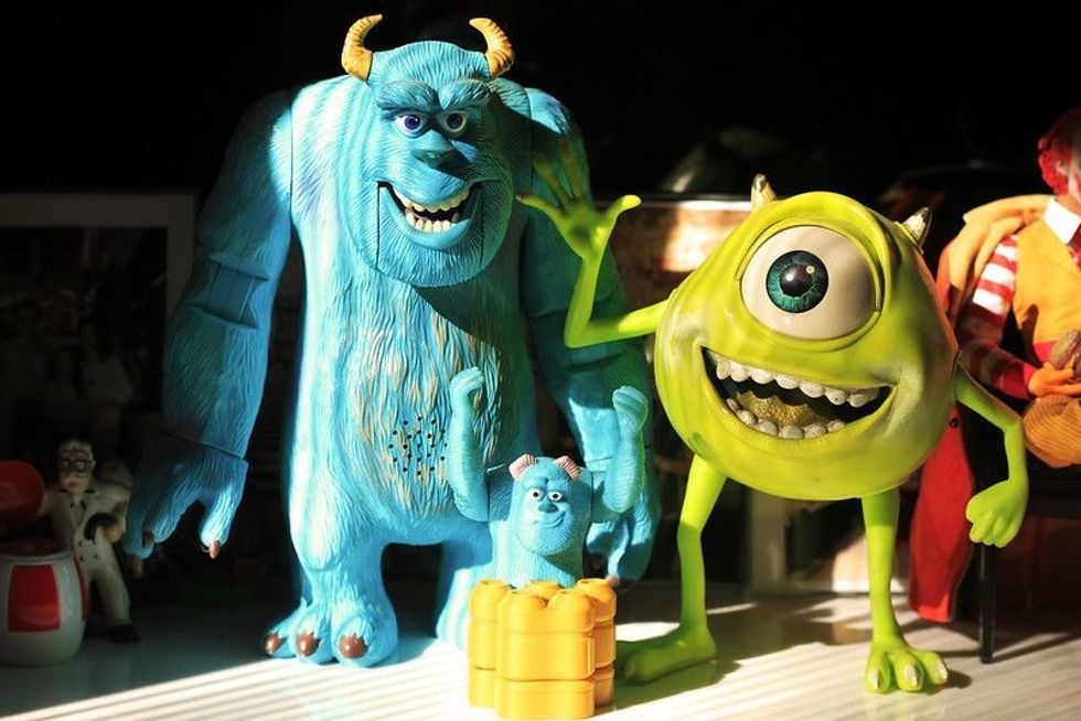 Figurines of James P. Sullivan and Mike Wazowski from Monsters Inc.