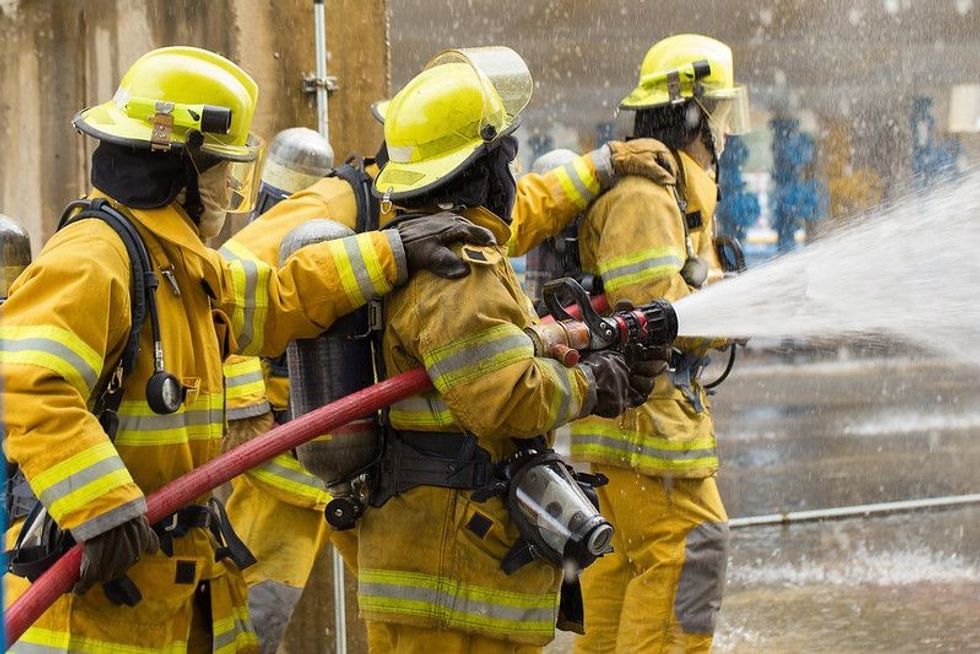 Fire fighter squad splashing water