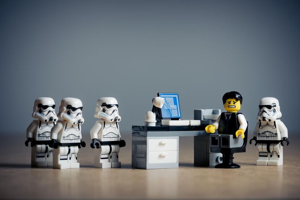 Five lego figures of the Star Wars franchise.
