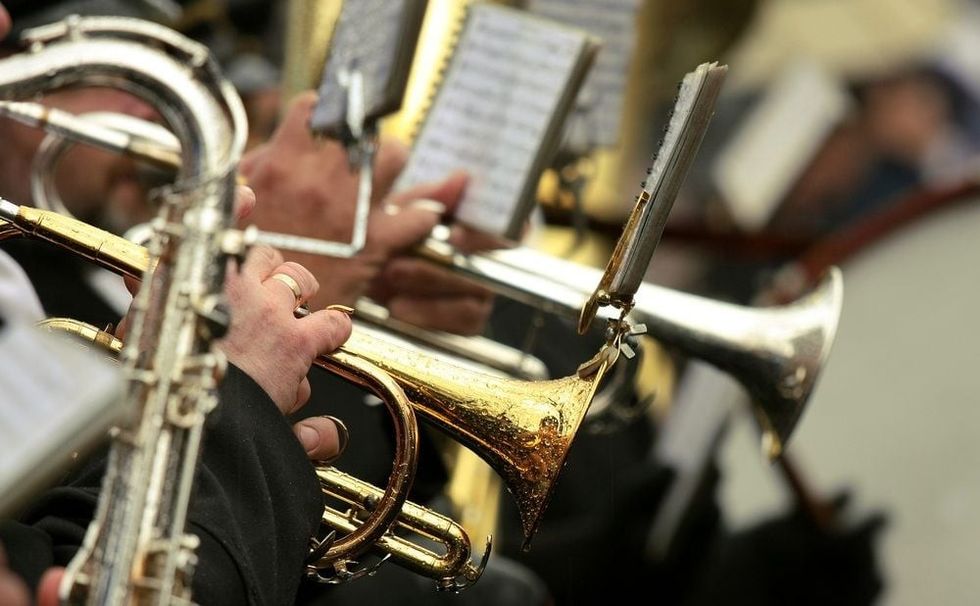 Focused trombone in an orchestra.