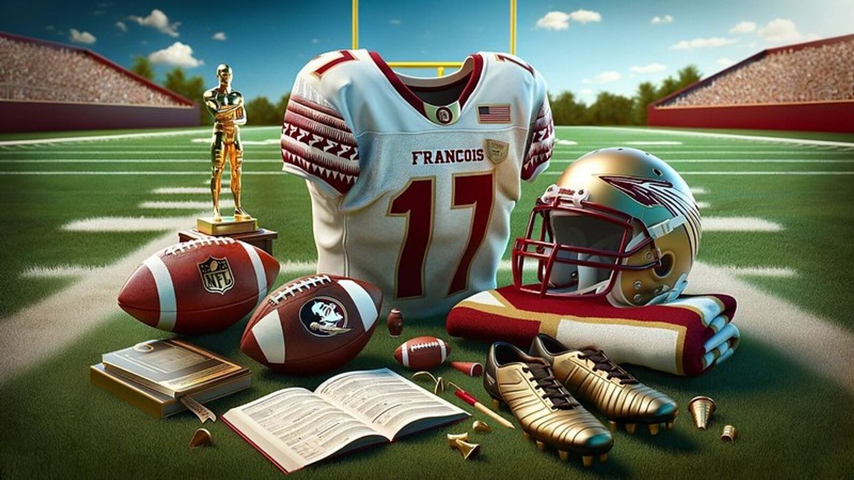 Football-related items on a grassy field, including a helmet, jersey with the name 'Francois', football, playbook, cleats, and a trophy.