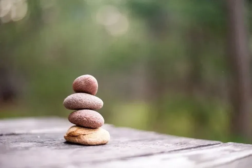 Four rocks on top of each other representing balance