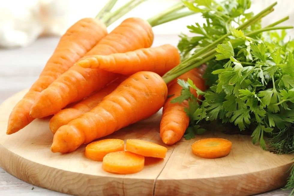 Fresh young carrot on the table.