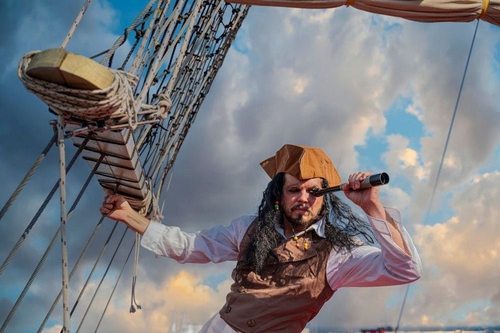 Funny pirate captain on a pirate ship