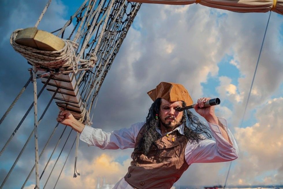 Funny pirate captain on a pirate ship