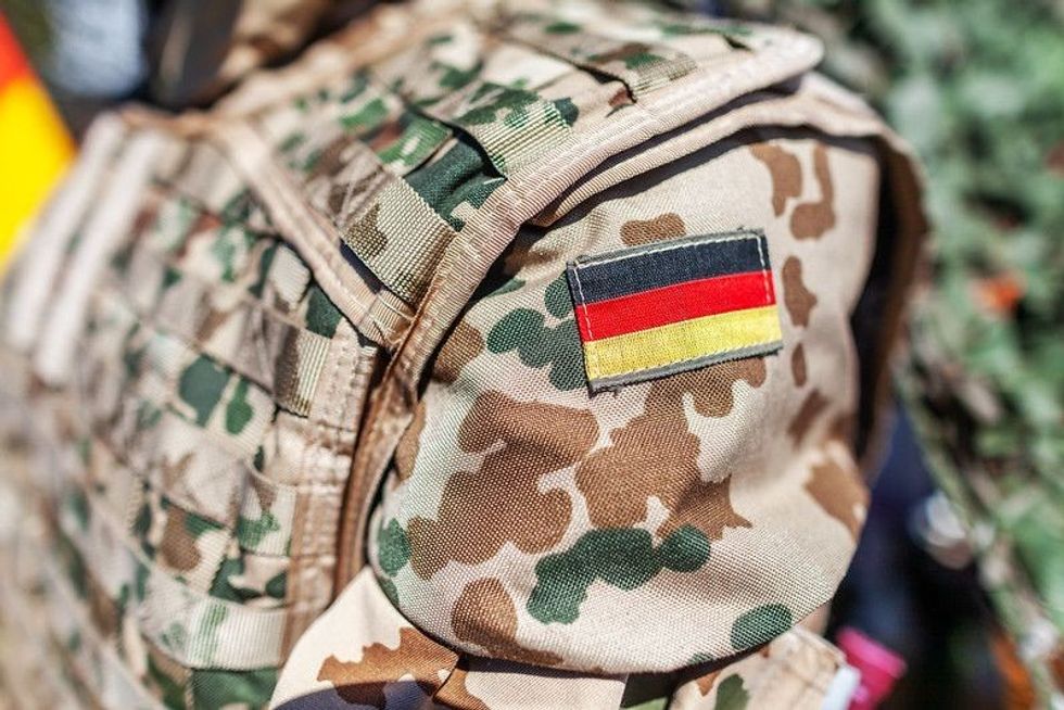 german flag on a german soldier desert uniform