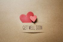 Get well soon message with handmade small paper hearts