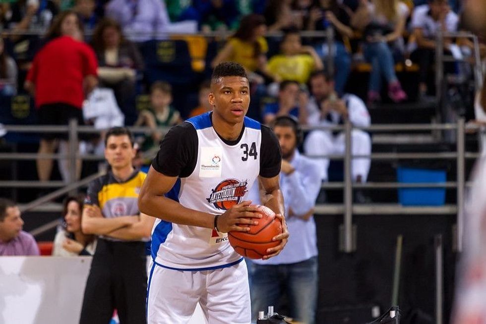 Giannis Antetokounmpo playing basketball