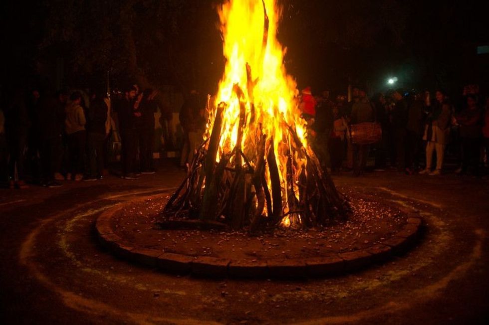 Giant bonfire lit for the auspicious festival