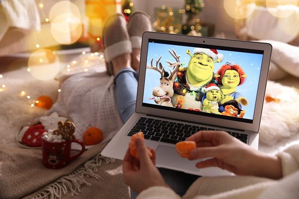 Girl watching Shrek on laptop