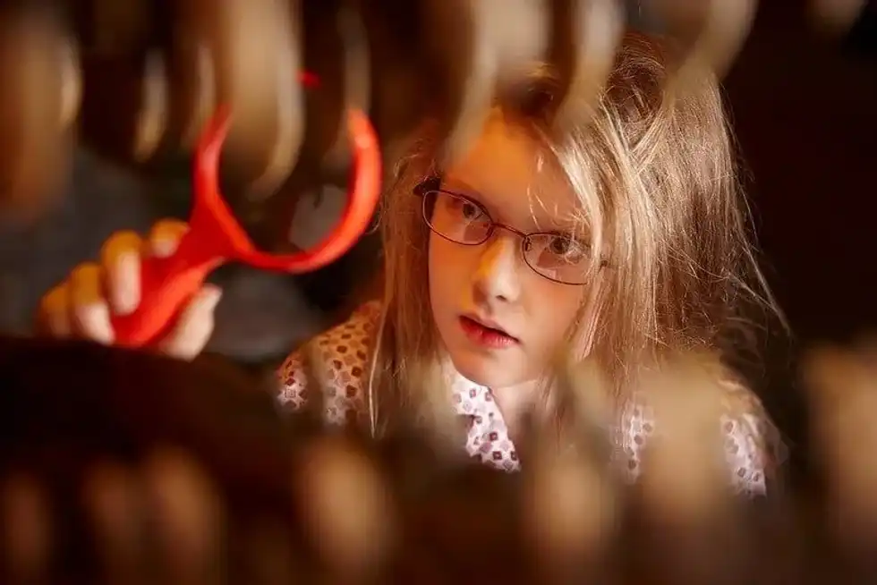 Girl who loves dinosaurs looking for best dinosaur gifts for kids