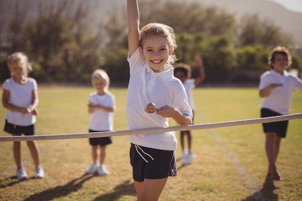 Girl winning the race in the park