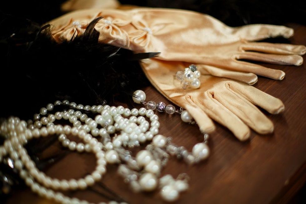 Gloves decorated with white beads