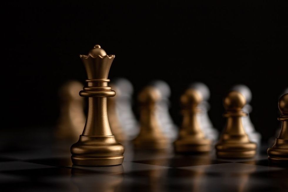 Gold queen is the leader of the chess in the game on board.