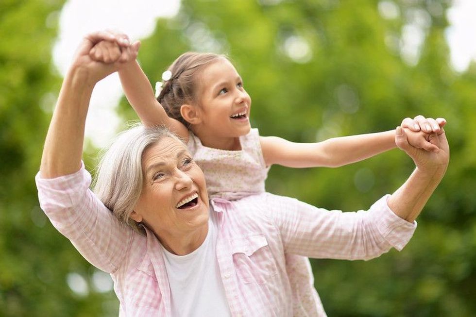 Grandmother with granddaughter in park