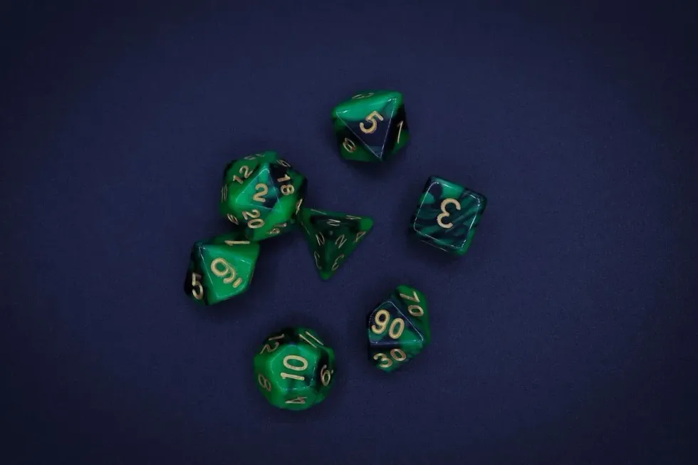 green d20 dice from dungeons and dragons game