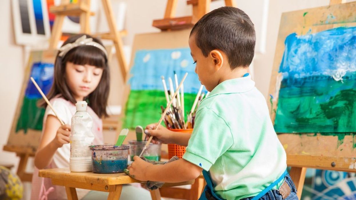Group of kids painting landscape