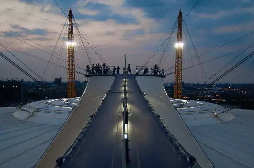 Groups on top of the O2 Arena just after the sun has set.