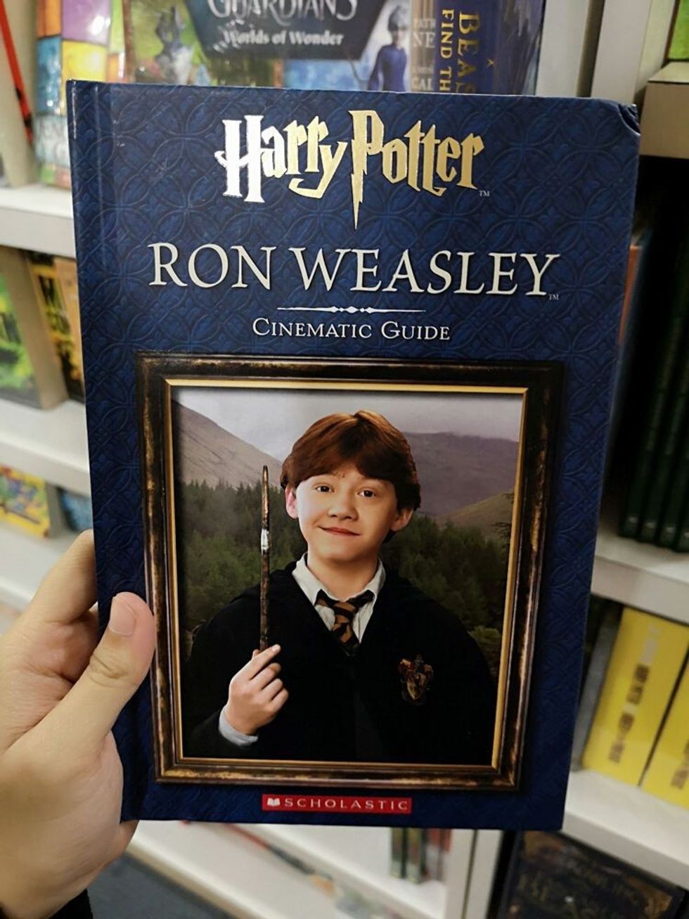 Hand hold a HARRY POTTER - RON WEASLEY book for sell in the book stores