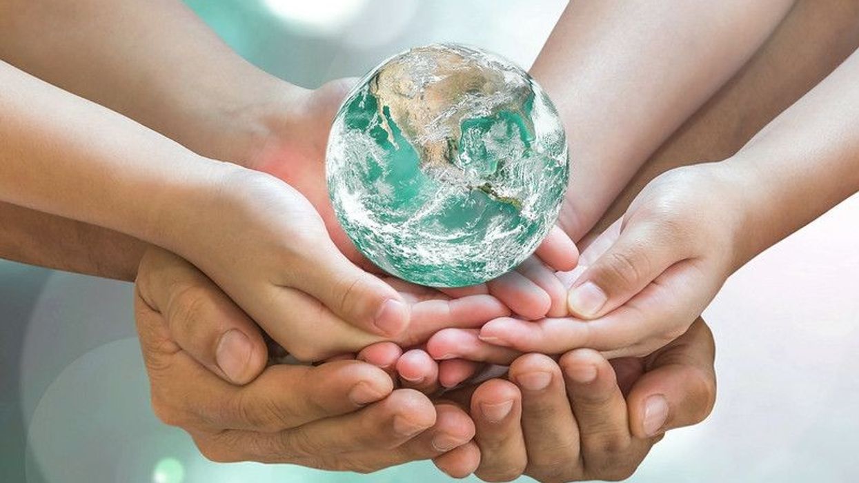 Hands protecting earth 