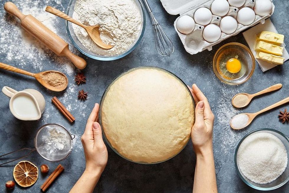 Hands working with dough preparation recipe bread