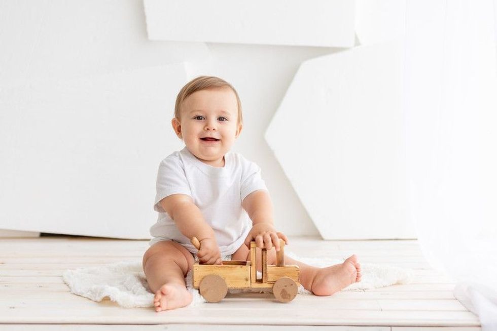happy cute little baby six months old in a white t-shirt and diapers - Nicknames