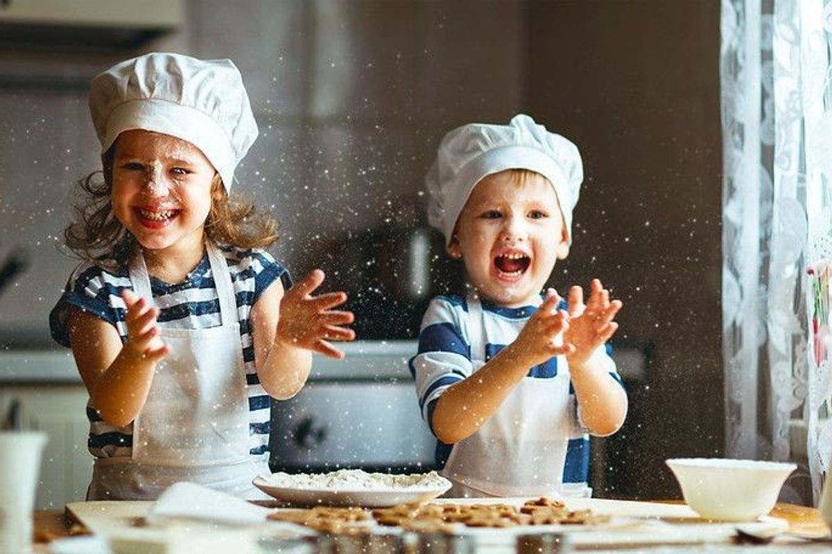 Happy family funny kids are preparing the dough
