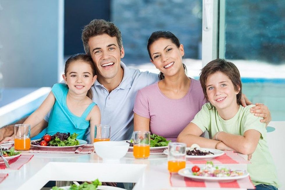 Happy family together on dinning table