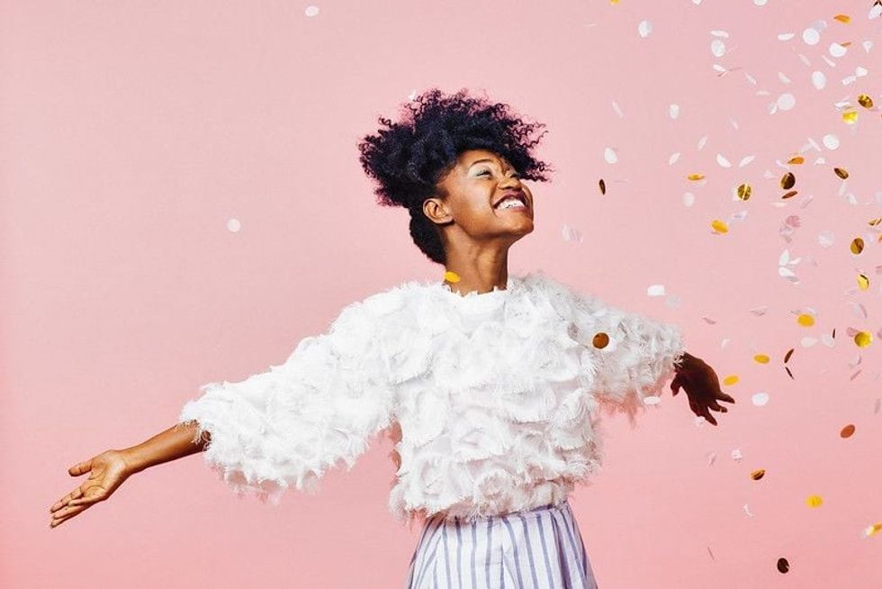 Happy girl in pink background.