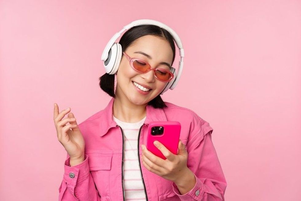 Happy girl listening to music.