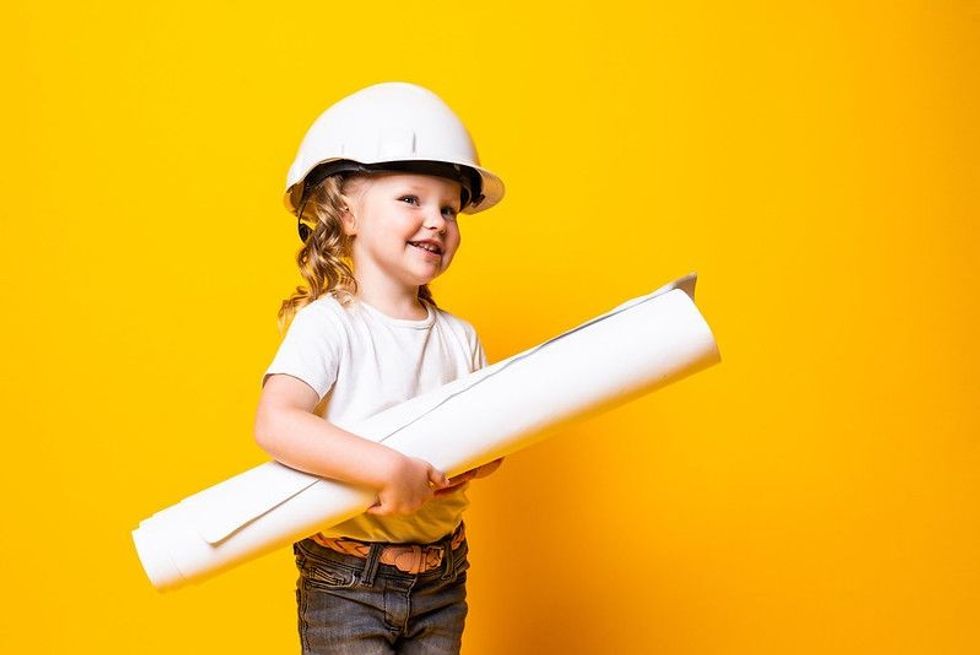 Happy girl with yellow background