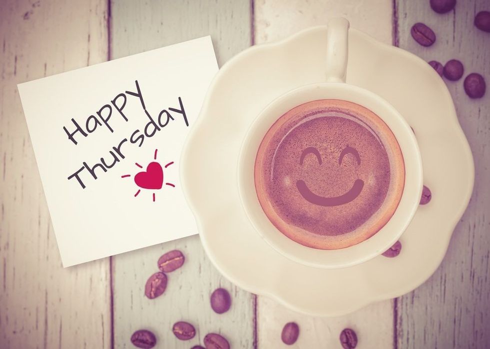 Happy Thursday with coffee cup on table.