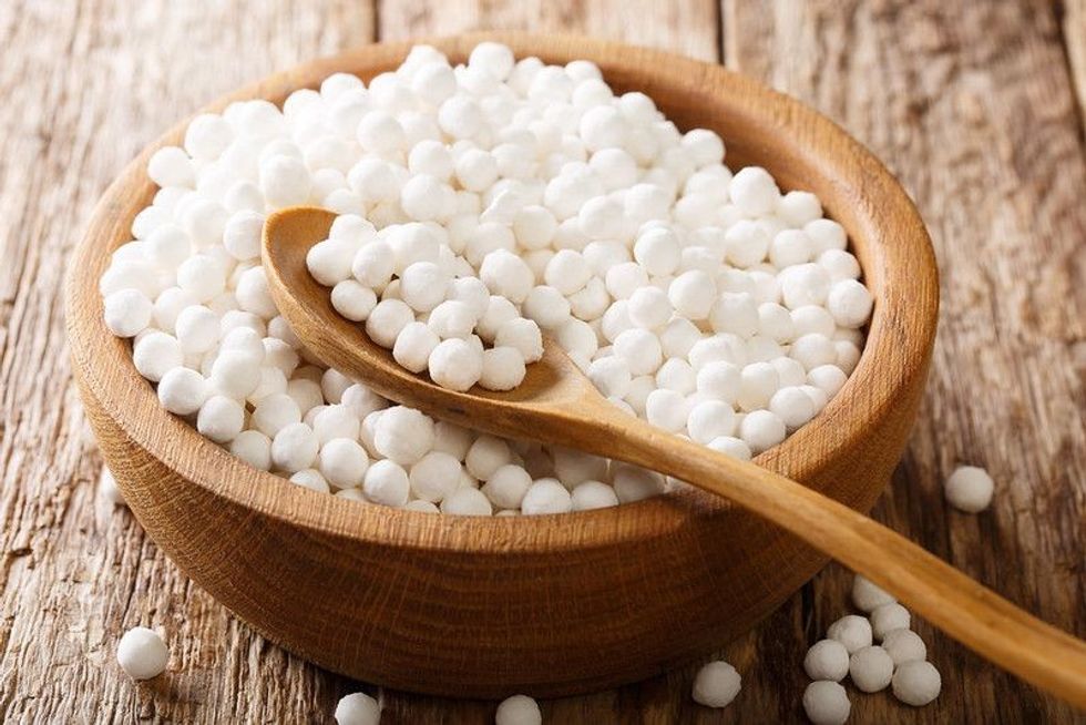 Heap of tapioca pearls close-up in a bowl on a wooden table