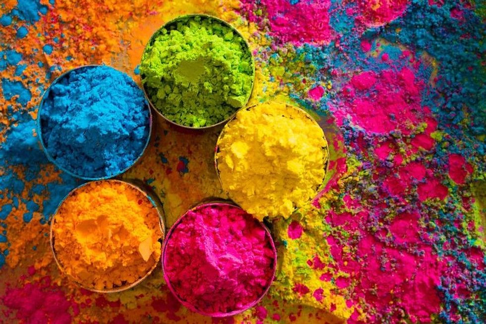Holi traditional color powders in five bowls.