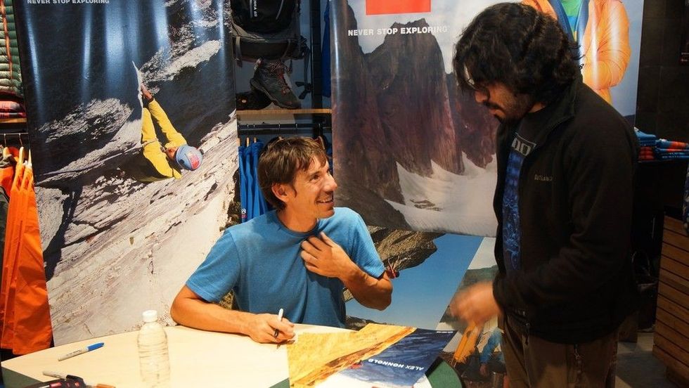 Honnold signing autographs at a store