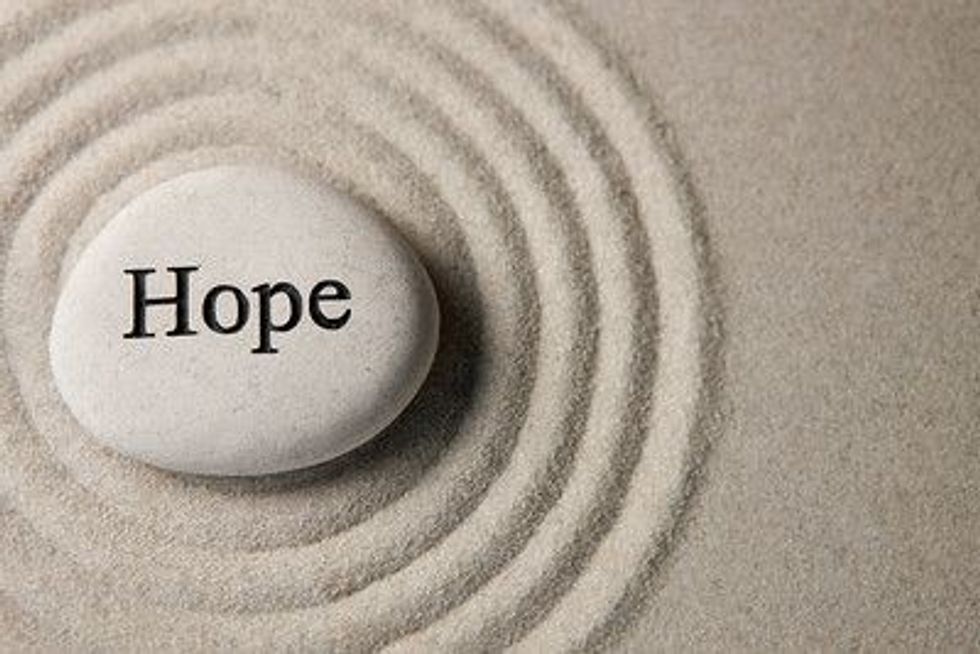 HOPE pebble creating ripples on sand