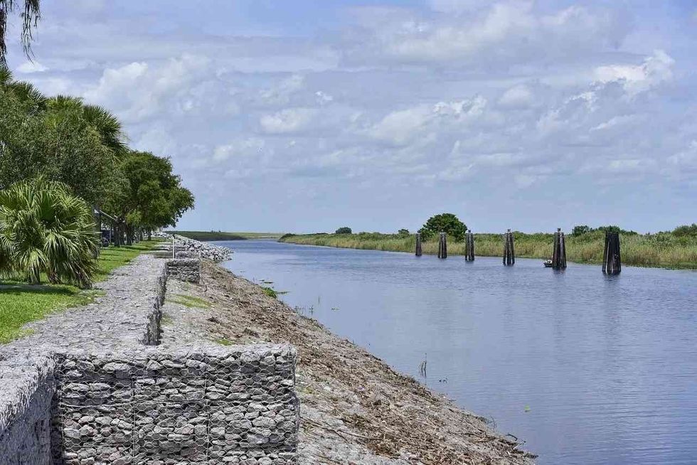 How is the environment affected by the pollution at Lake Okeechobee.