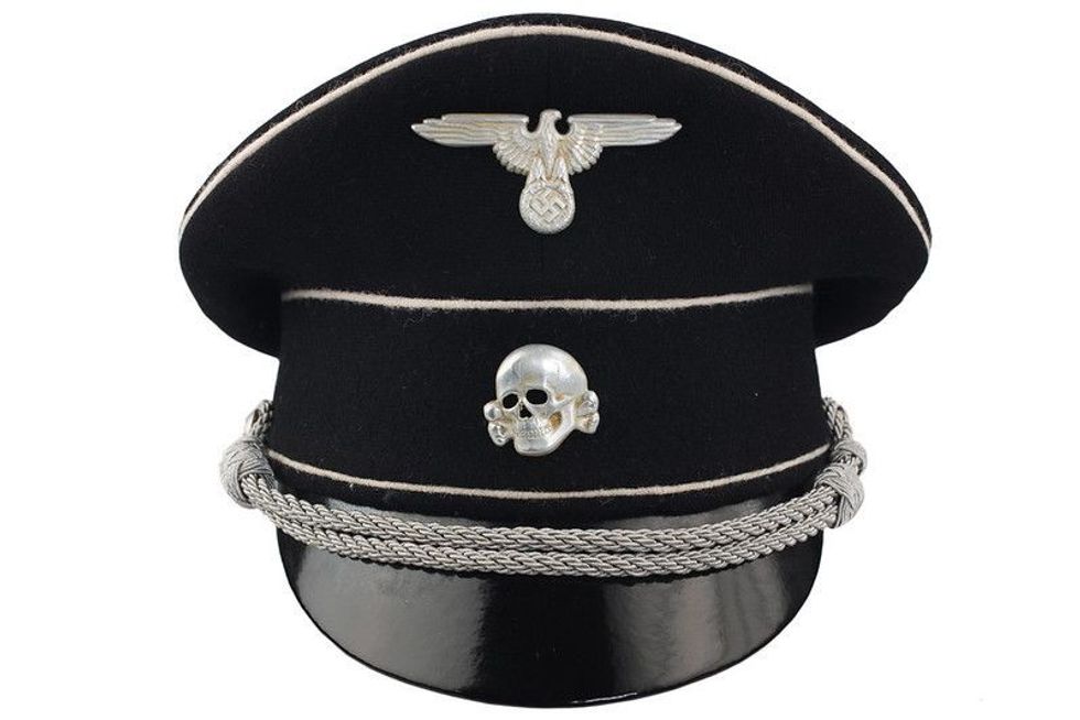 Human skull on black cap