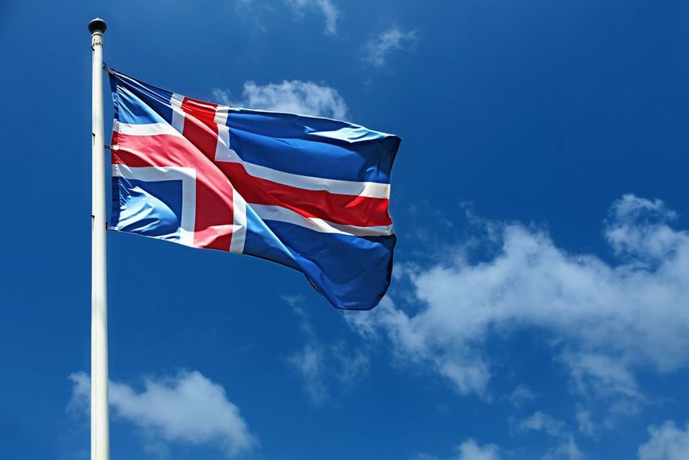 Icelandic flag hoisted on a pole